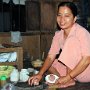 souple lady prepares food on the table<br />
